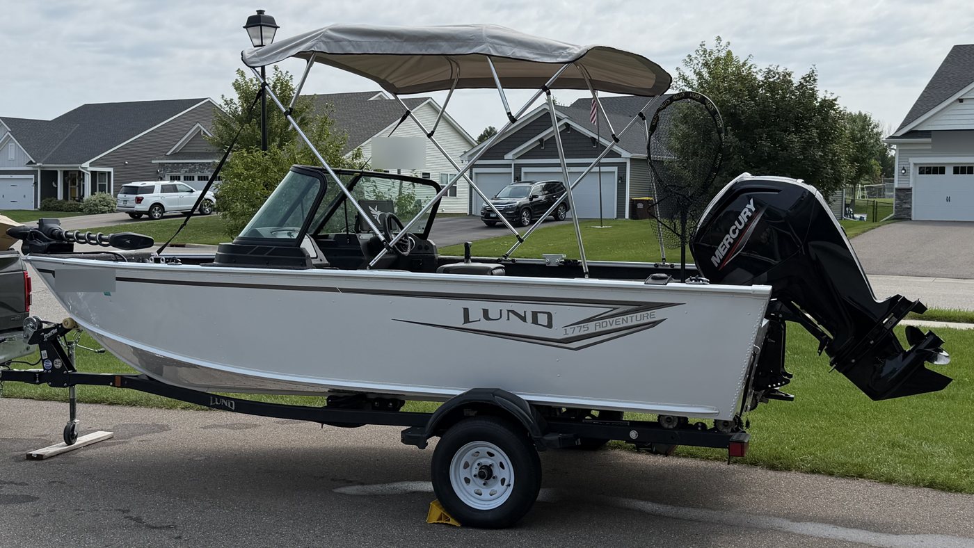 Lund 1775 Adventure with a Mercury outboard on its trailer