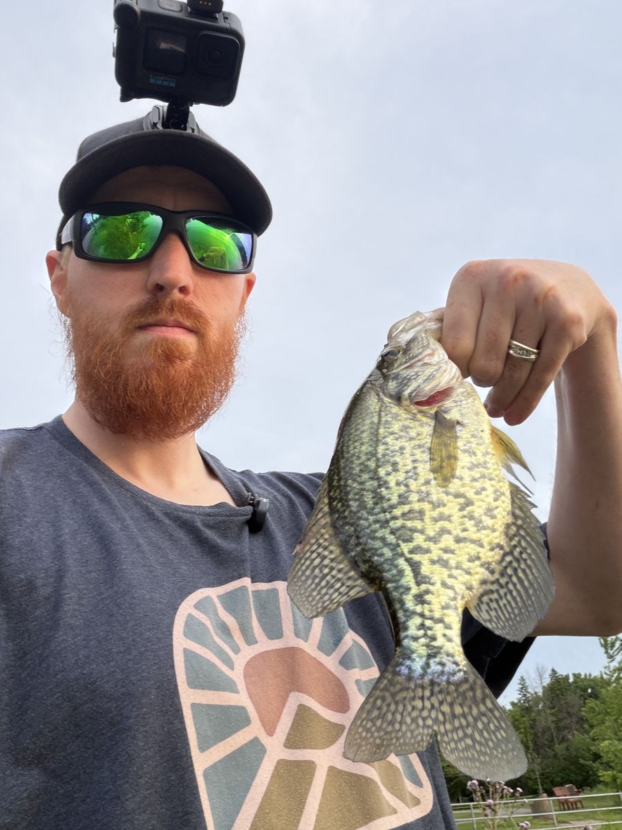 Scott holding up a large crappie