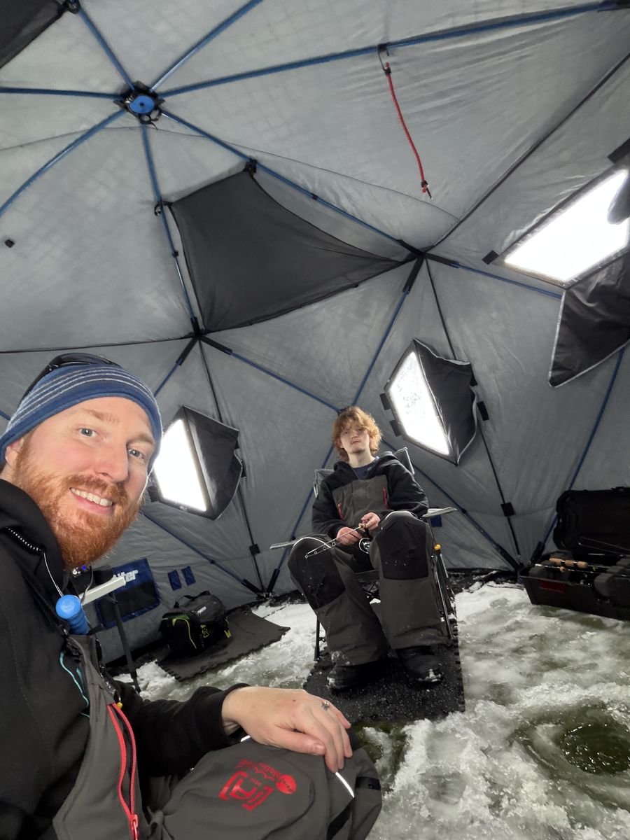 Scott and his son inside the ice fishing hub